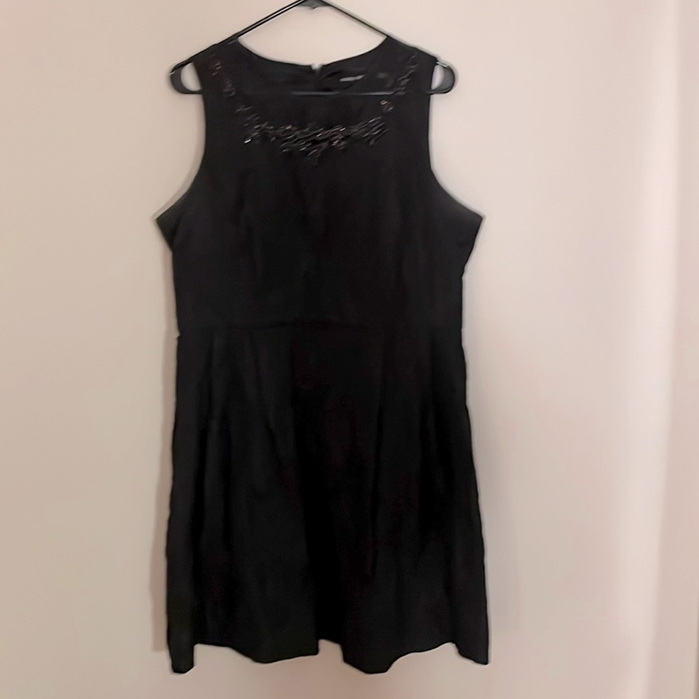 Fit & flare, crinkle fabric dress with fancy neckline is the perfect LBD!